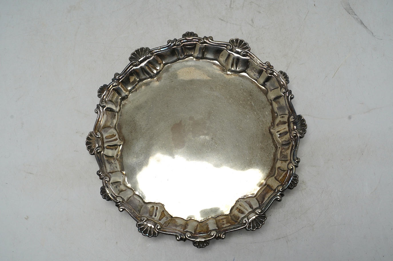 An early George III silver waiter, Ebenezer Coker, London, 1761, 17.1cm, 5.7oz. Condition - poor